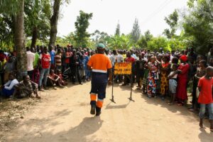 Locals gather at the cordoned scene outside the Mpondwe Lhubirira Secondary School, after militants linked to rebel group Allied Democratic Forces (ADF) killed and abducted multiple people - REUTERS