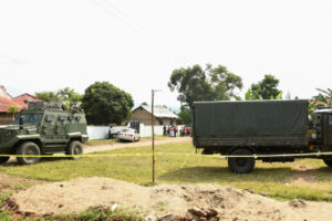 FILE - Ugandan security forces cordon the scene outside the Mpondwe Lhubirira Secondary School, after militants linked to the rebel Allied Democratic Forces killed and abducted multiple people, in Mpondwe, western Uganda, June 17, 2023.