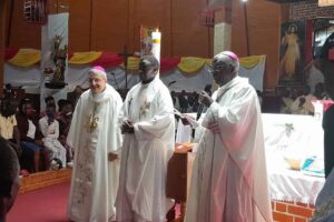 Lawrence Mukasa (Middle) is the new Bishop of Kasana-Luwero. (Courtesy photo)